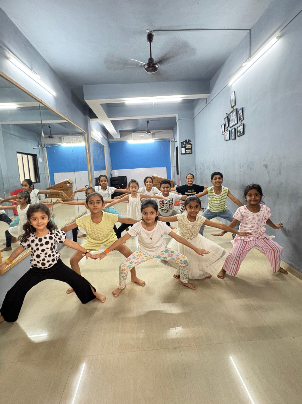 Kids practising wide stance dance poses